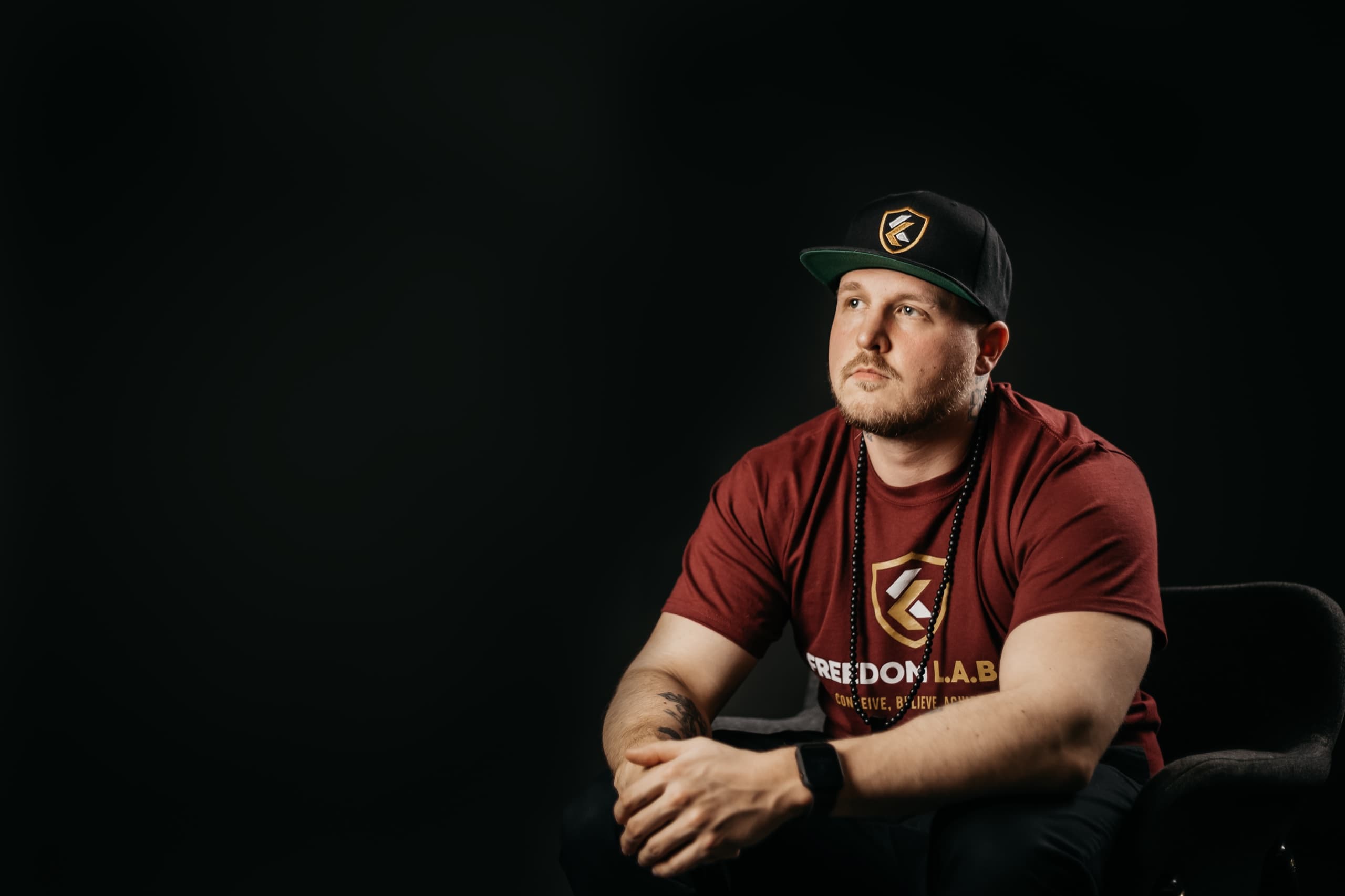 Mikey Bars seated for a studio portrait